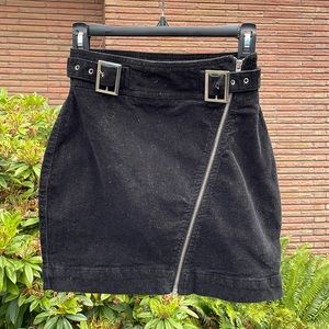 Black Corduroy Skirt, with diagonal zipper and Crome buckles. Size XS
